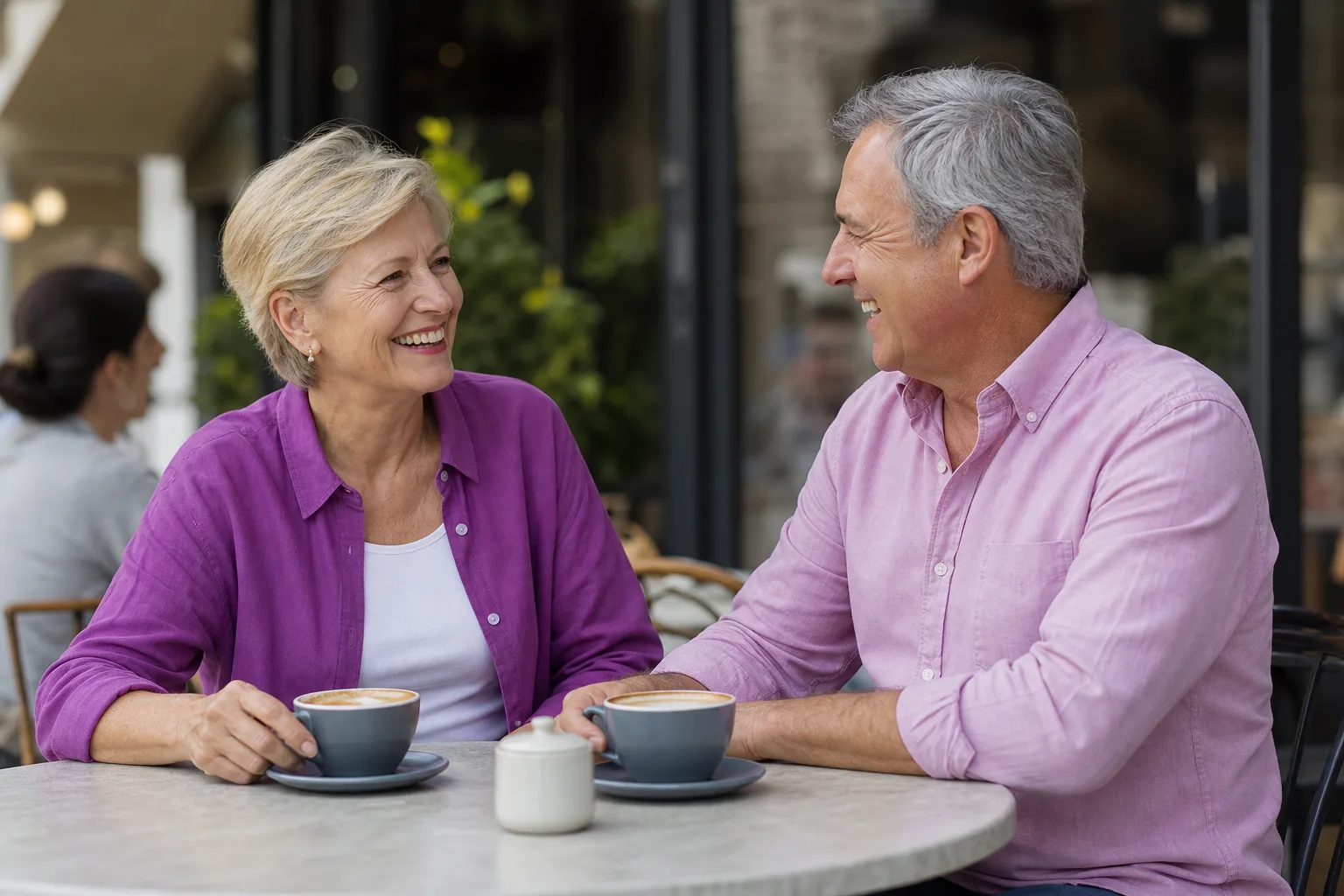 Widowed woman over 50 enjoying a relaxed conversation over coffee