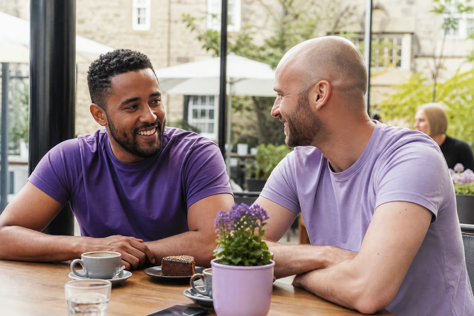 Two men talking over coffee in central Winchester