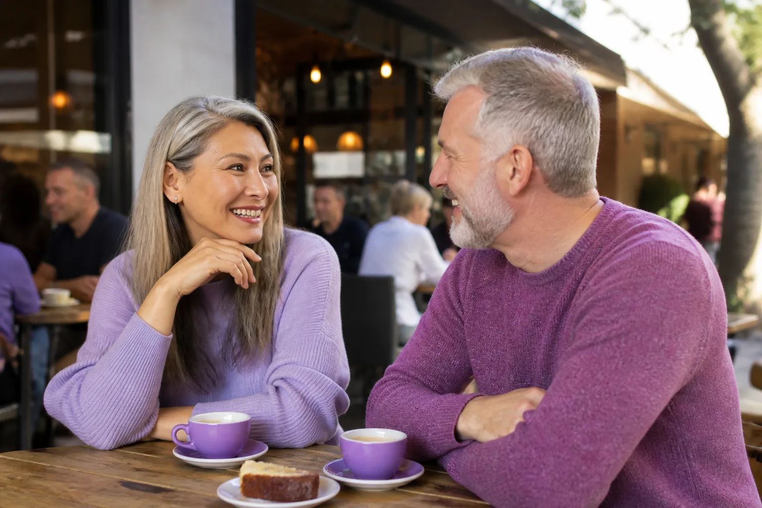 Mature couple talking over coffee in a Hampshire town centre