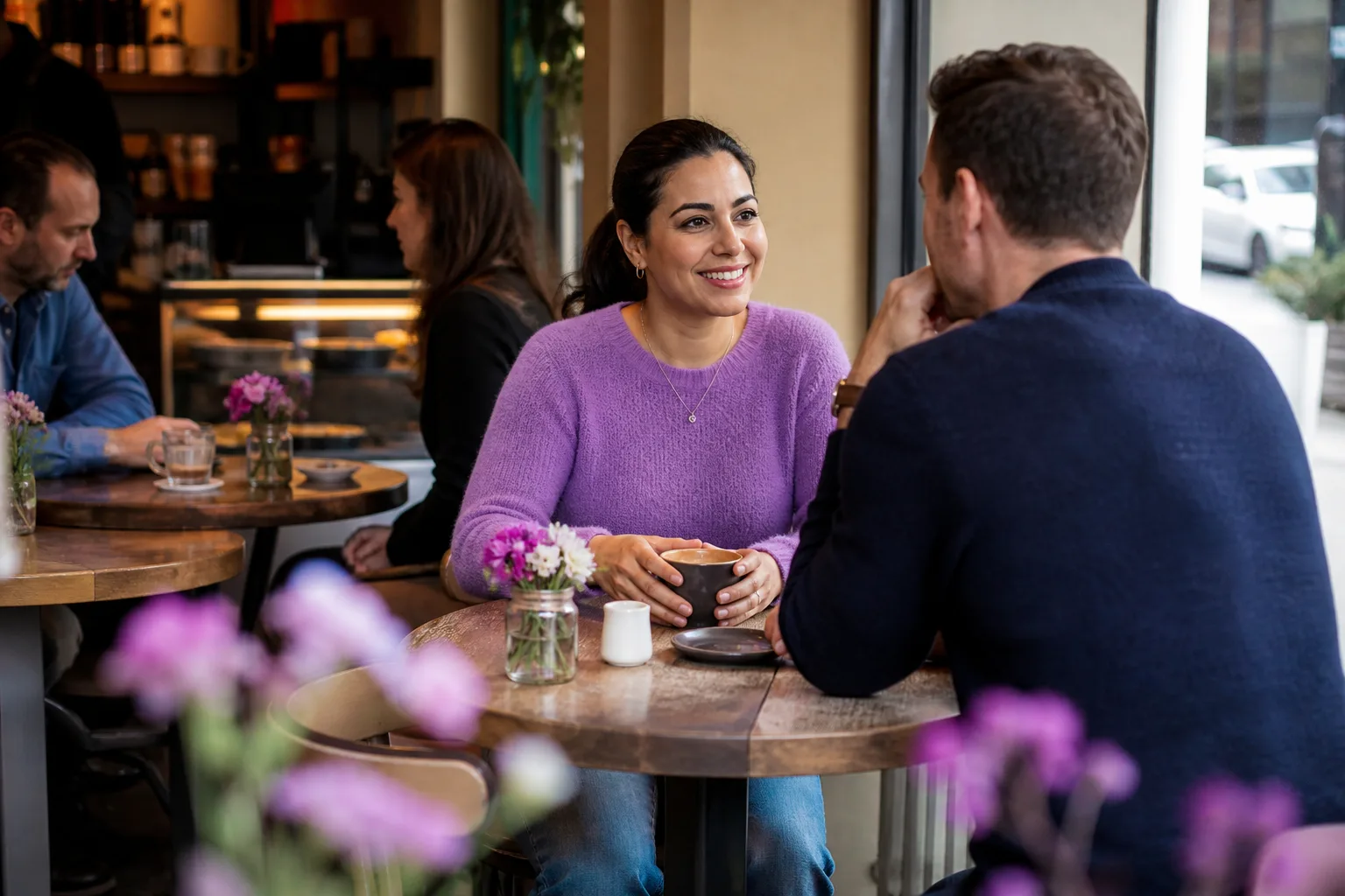 Two people talking over coffee in Basingstoke town centre